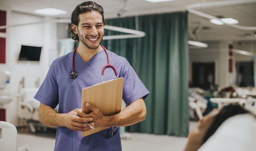 male doctor laughing - working in aunz