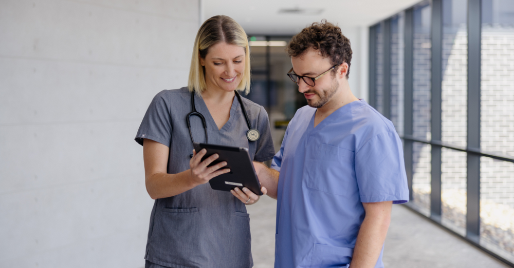 doctors looking at wellbeing guide